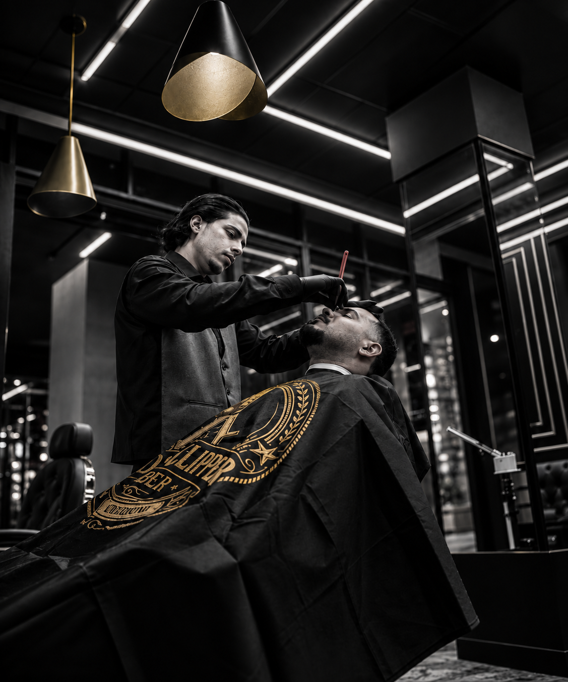 A Golden Clipper barber performing a precision beard service